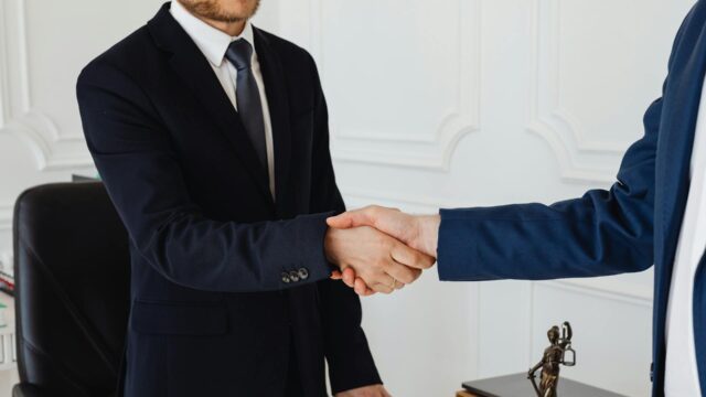 Corporate handshake showing support from a reno business lawyer