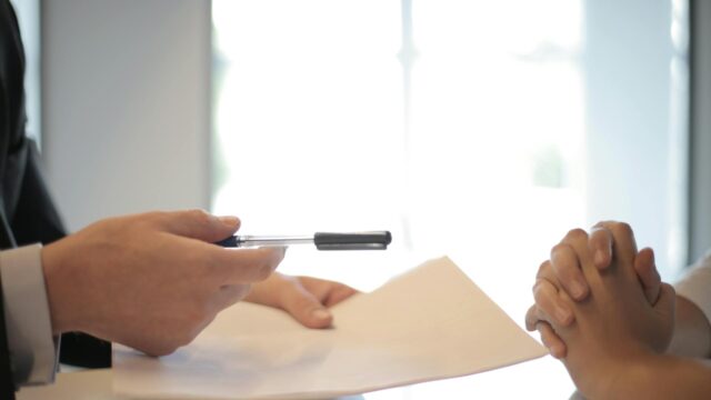 Handing over documents during a trusts lawyer reno consultation for Nevada asset protection planning